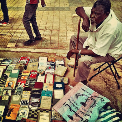 Man at the Mafroosh used book market. Photo: Khalid Albaih. Creative Commons license.